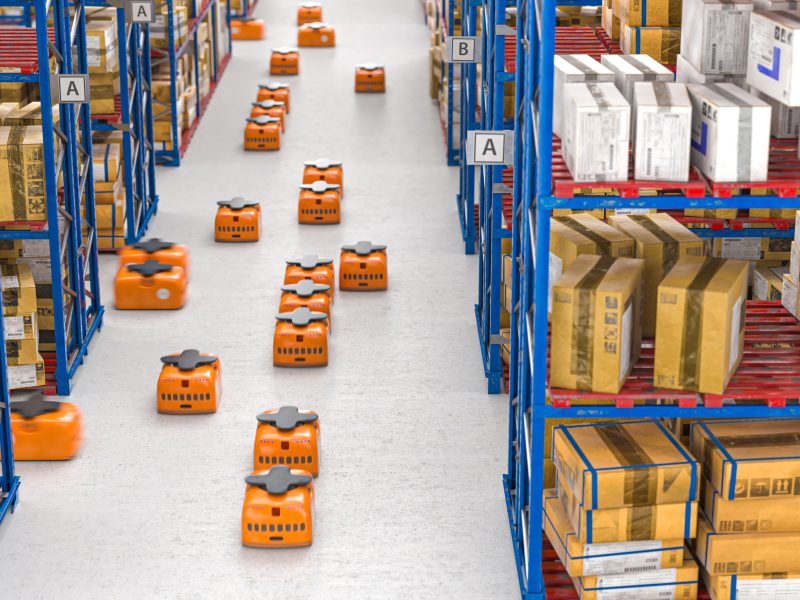drones moving inside a modern warehouse full of goods